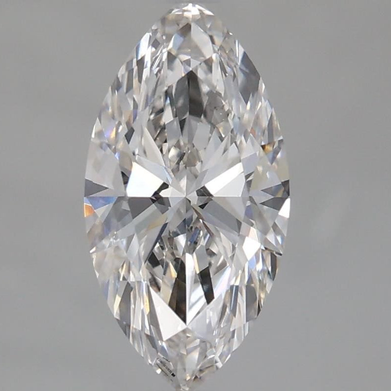 A single marquise-cut diamond shown in a close-up studio shot against a smooth gray background.