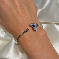 18K White Gold Flower with Diamonds and Blue Sapphire Bangle Bracelet