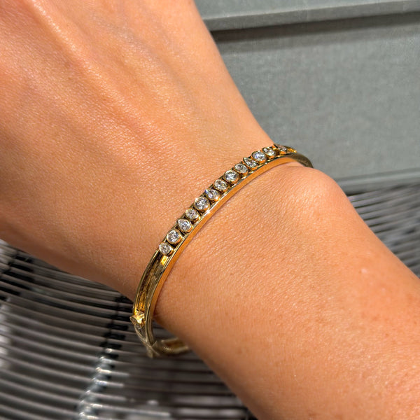 Moving Diamond Bezel with 14K Yellow Gold Bangle Bracelets