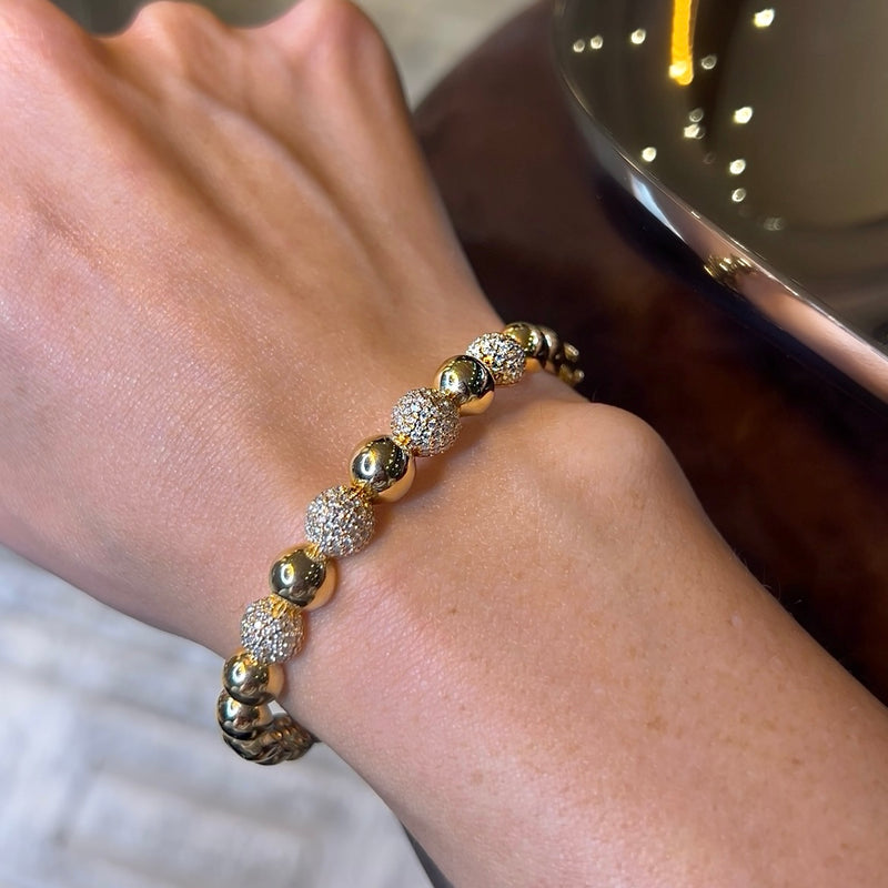 Brazalete con cuentas de oro amarillo con diamante 