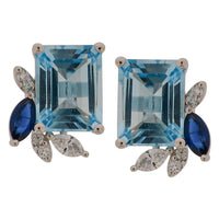 Sky Blue Topaz & Diamond Leaf Stud Earrings with 18K White Gold. Carefully curated into the Everyday Designs. 