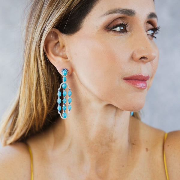 Sleeping Beauty Turquoise with  Blue Sapphire & Diamond Dangle Earrings. This pair of earrings are perfect for special occasions. 