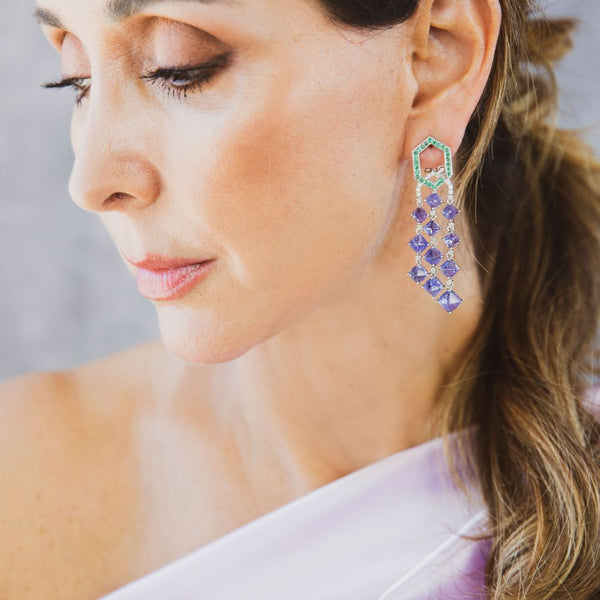 This pair of earrings are perfect for special occasions, this design gives the piece a unique touch.  Tanzanite Sugarloaf Dangle with Emerald Earrings.