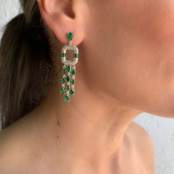 This pair of earrings are perfect for special occasions, this design gives the piece a unique touch.  Tsavorite Dangle & Diamond Square Earrings