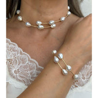 Gragantilla con perla barroca y  oro amarillo de 14k