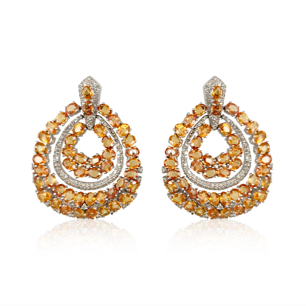 Orange Sapphire Circle Earrings: Diamonds: 1.44 ct Yellow Sapphire: 21.71 ct Silver with Rhodium Plated weight: 13.34 grams Gold Post: 0.15 grams