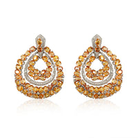 Orange Sapphire Circle Earrings: Diamonds: 1.44 ct Yellow Sapphire: 21.71 ct Silver with Rhodium Plated weight: 13.34 grams Gold Post: 0.15 grams