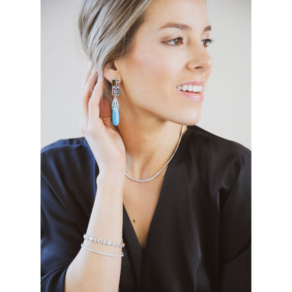 This pair of earrings are perfect for special occasions, this design gives the piece a unique touch.  Turquoise Drop & Tourmaline Earrings
